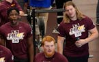 (Left to right) Boye Mafe, Ko Kieft and Blaise Andries watched their teammates compete before NFL scouts at the Gophers pro day on March 16.