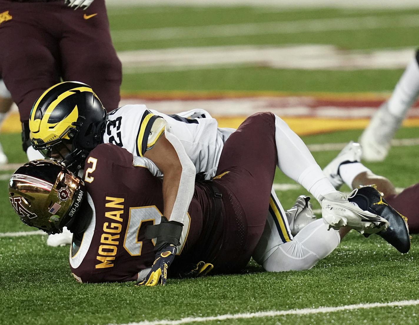 Michigan Wolverines linebacker Michael Barrett (23) tackled Minnesota Gophers quarterback Tanner Morgan (2) in the first quarter. ] Mark Vancleave Ð The Minnesota Gophers played the Michigan Wolverines on Saturday, Oct. 24, 2020 at TCF Bank Stadium in Minneapolis.