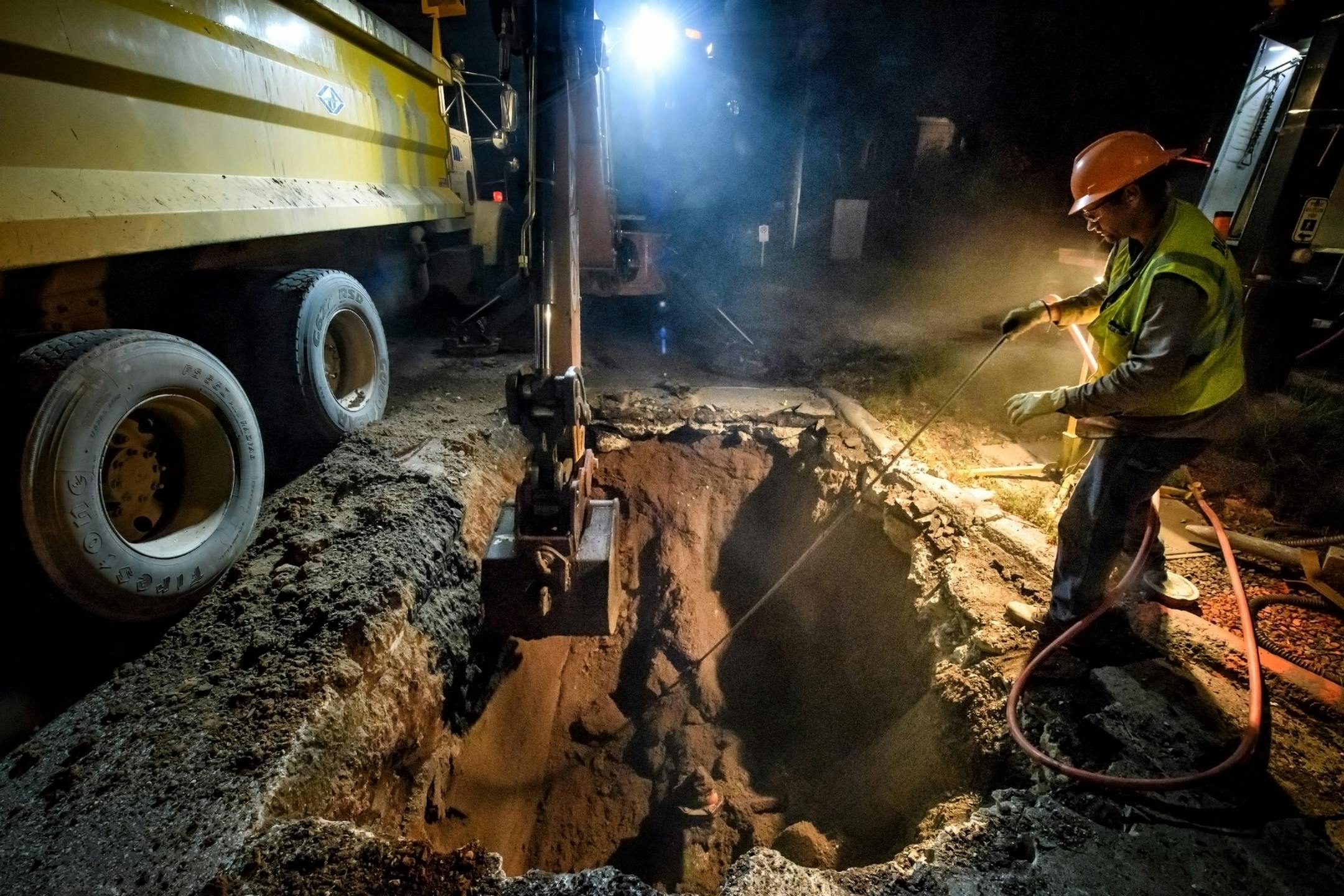 Workers from Duluth Public Works and Utilities Department replace a broken water main valve at Grand Avenue and 40th Ave West. Work was done overnight to avoid disrupting traffic during the day.