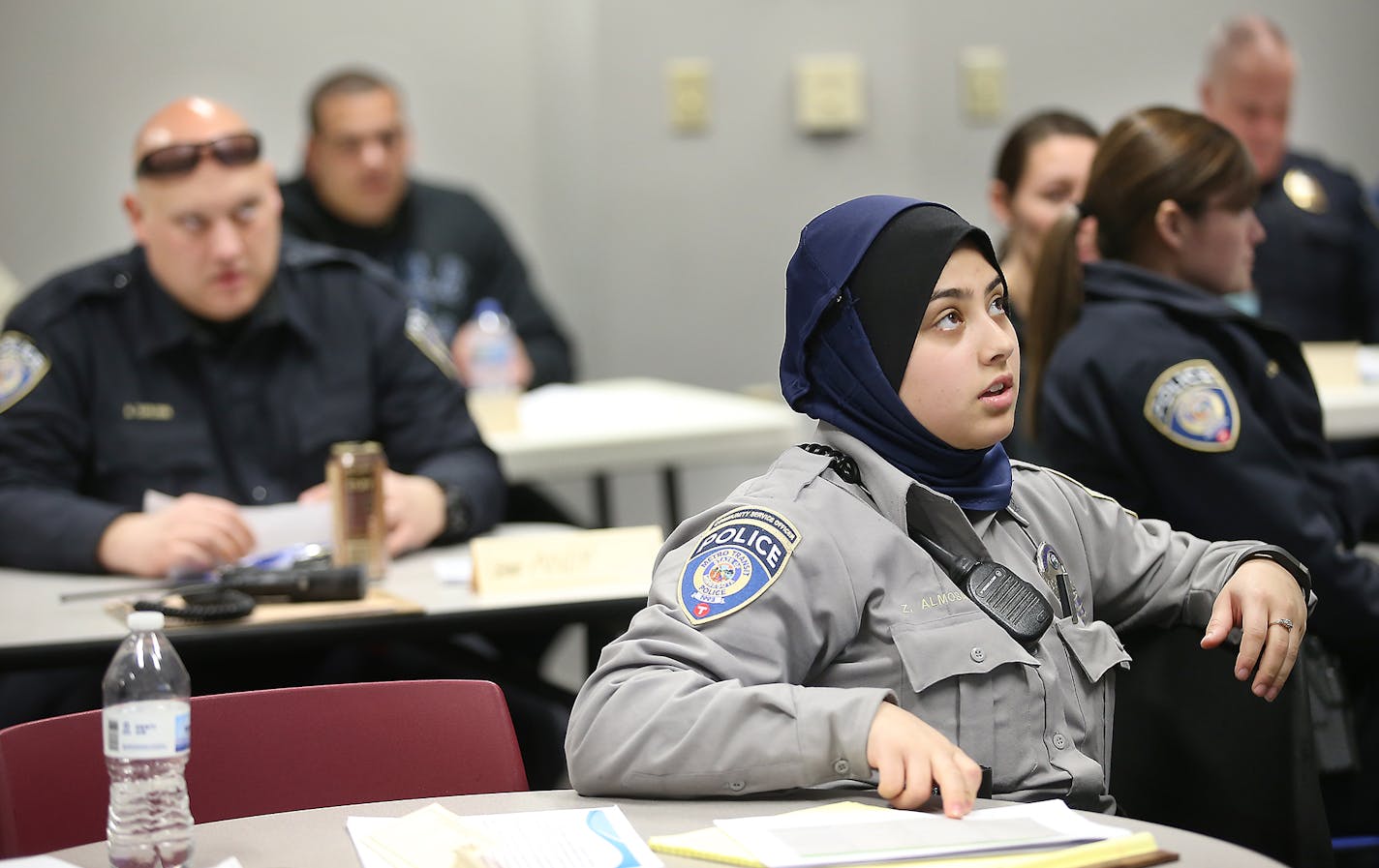 Zahra Almosawi, a community service officer, joined others from the Metro Police including Chief John Harrington, took a Somali language class, Wednesday, March 2, 2016 in St. Paul, MN. ] (ELIZABETH FLORES/STAR TRIBUNE) ELIZABETH FLORES &#x2022; eflores@startribune.com