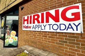 A hiring sign is displayed in Riverwoods, Ill., on April 16, 2024. On Thursday, June 27, 2024, the government reports on the number of Americans who a