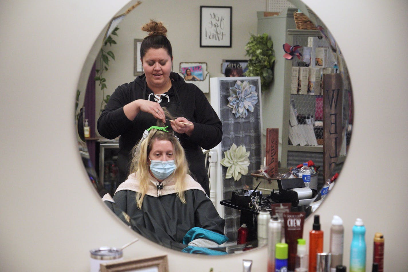 Brittney Ewert, owner of Glamour Salon in downtown Wadena, Minn., is not vaccinated and has already had COVID-19 but honors her clients' requests if they ask her to wear a mask. Wadena is currently one of Minnesota's hot spots for COVID-19 infections.