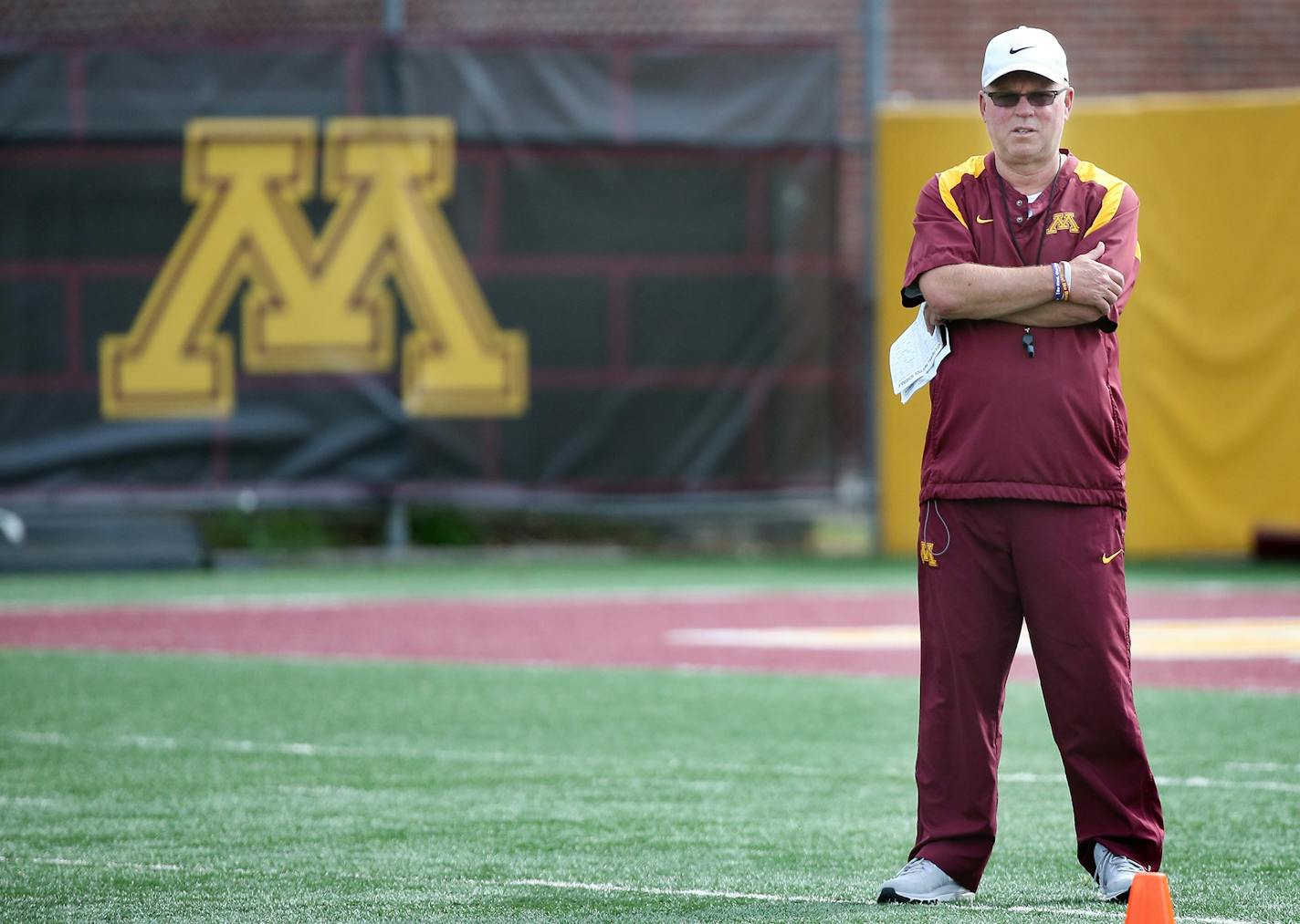 Minnesota coach Jerry Kill watched the different drills during the first practice of the season for Gophers football at Gibson-Nagurski field, Friday, August 7, 2015 in Minneapolis.