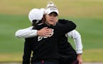 Nellyl Korda, right, gets a hug from Sei Young Kim after the final round of the LPGA Ford Championship on Sunday.