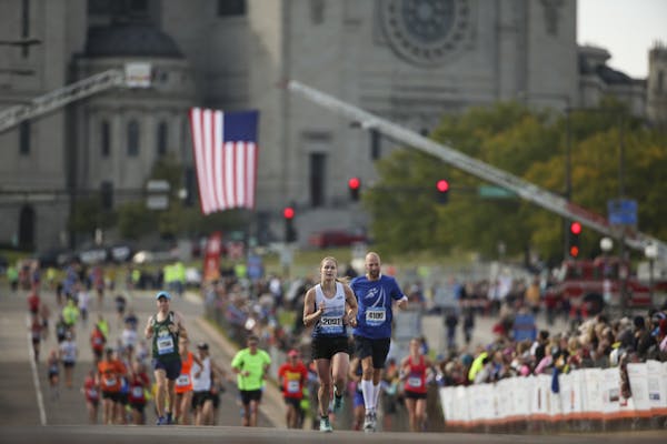 Runners finish the 2015 Twin Cities Marathon.