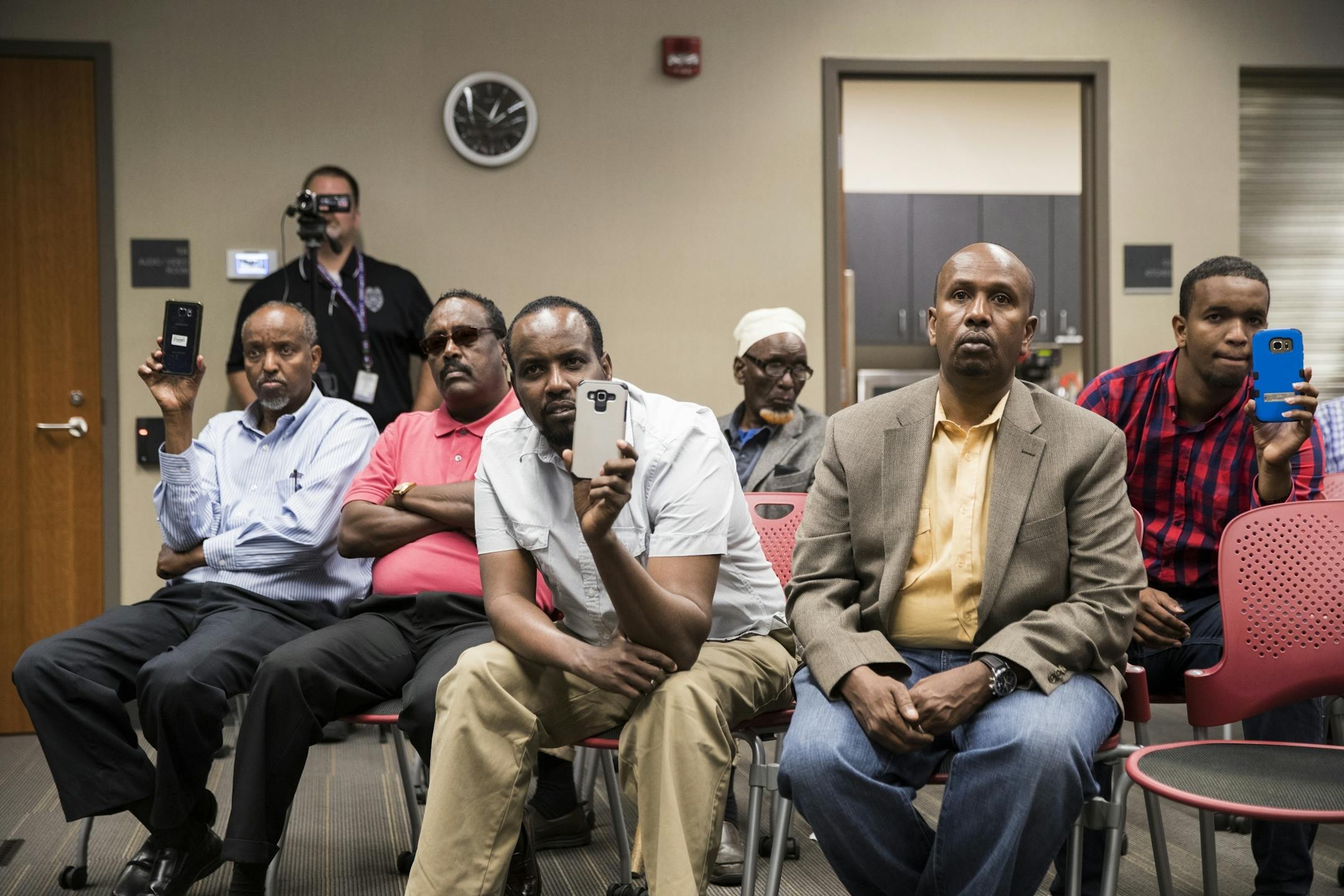 Members of the Somali community attend a press conference at the St. Cloud Police Station.