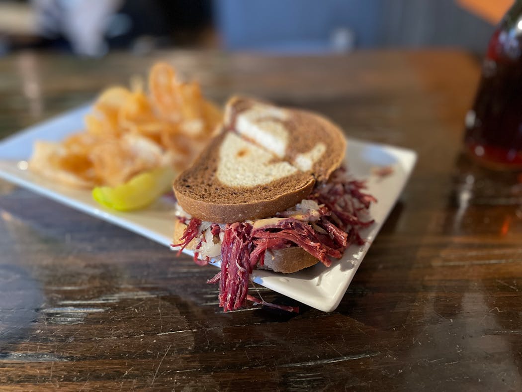 Abandon all hope of eating this Reuben with your bare hands.