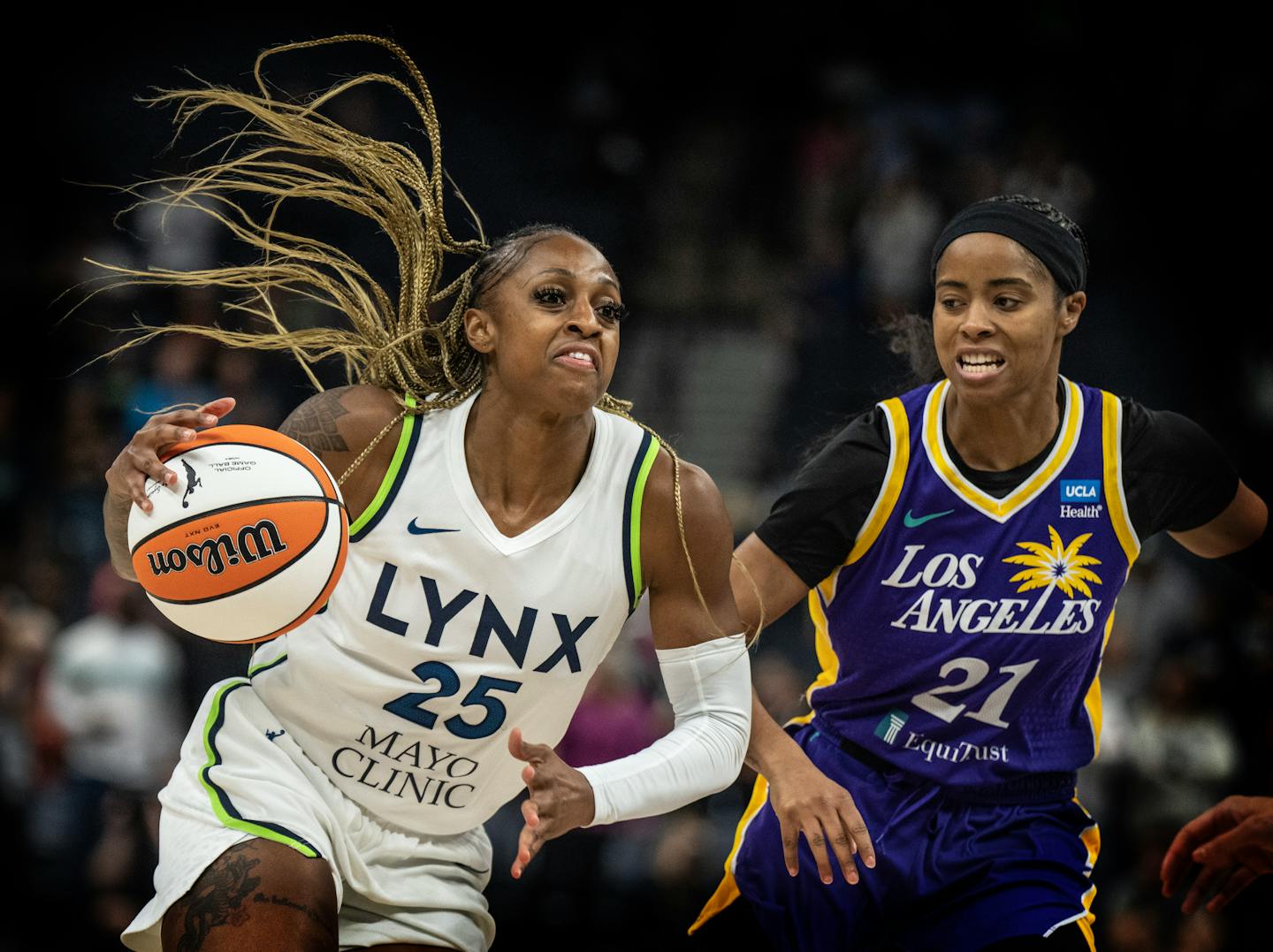 Minnesota Lynx guard Tiffany Mitchell (25) drove to the basket on Los Angeles Sparks guard Jordin Canada (21) in the fist half Sunday June 11,2023 in Minneapolis.] JERRY HOLT • jerry.holt@startribune.com