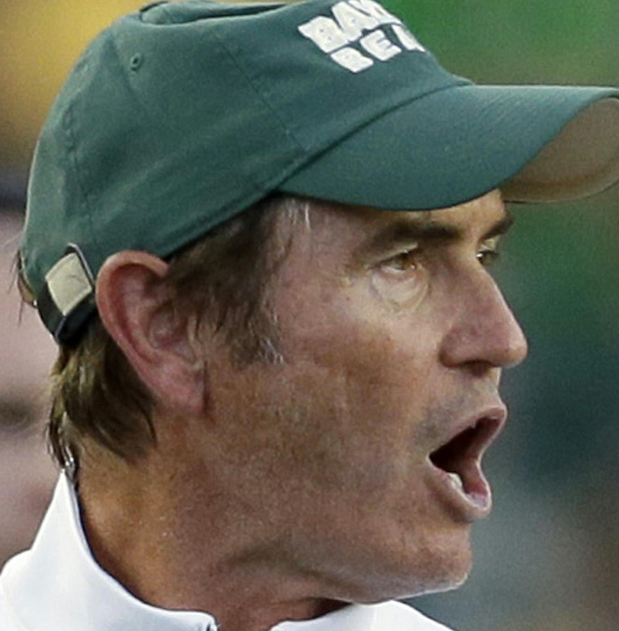 FILE - In this Sept. 12, 2015, file photo, Baylor coach Art Briles yells from the sideline during the first half of an NCAA college football game against Lamar in Waco, Texas. Baylor University's board of regents says it will fire Briles and re-assign university President Kenneth Starr in response to questions about its handling of sexual assault complaints against players. The university said in a statement Thursday, May 26, 2016, that it had suspended Briles "with intent to terminate." Starr w