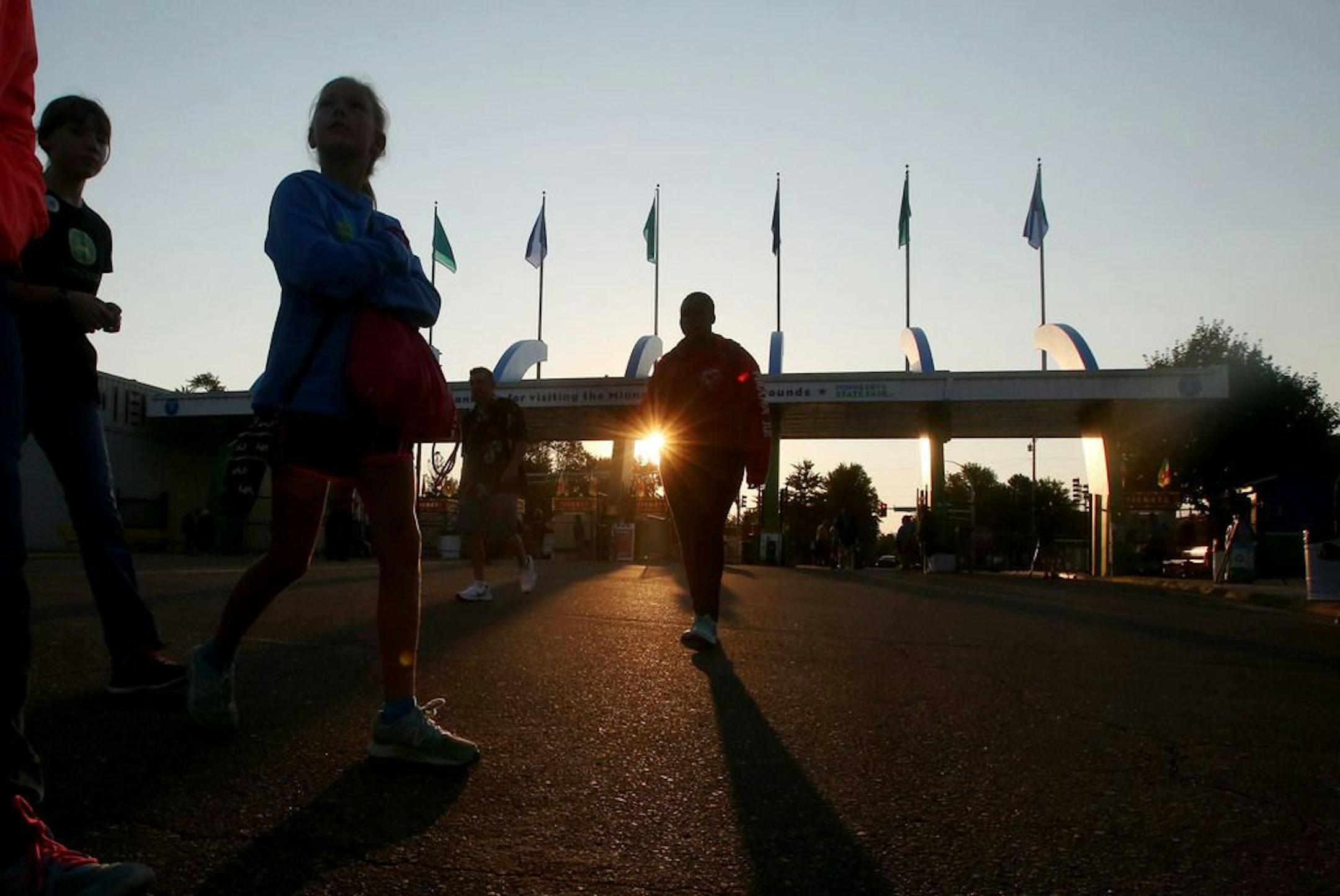 The sun rose above the main gate on the first day of the Minnesota State Fair in 2016, the year fair officials added bag checks at entrypoints.