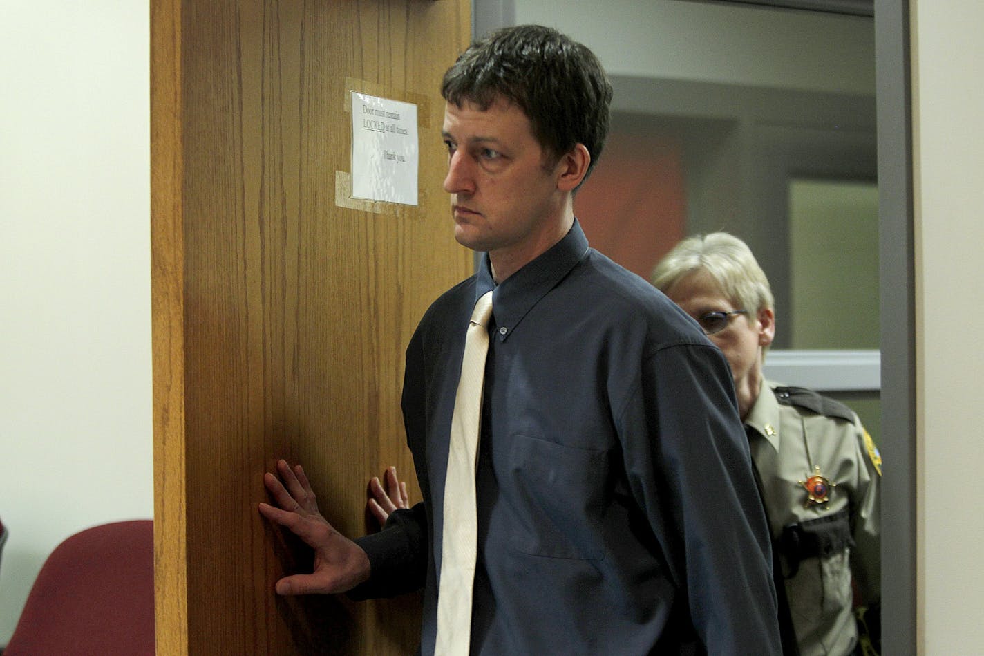 Aaron Schaffhausen made his way into court for the 9th day of testimony for his insanity trial at a St. Croix County Courtroom in Hudson, Wis., Friday, April 12, 2013. (ELIZABETH FLORES/STAR TRIBUNE) ELIZABETH FLORES � eflores@startribune.com