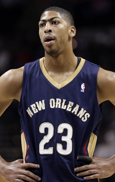 FILE - In this Nov. 25, 2013, file photo, New Orleans Pelicans' Anthony Davis looks on during a break in the first half of an NBA basketball game agai