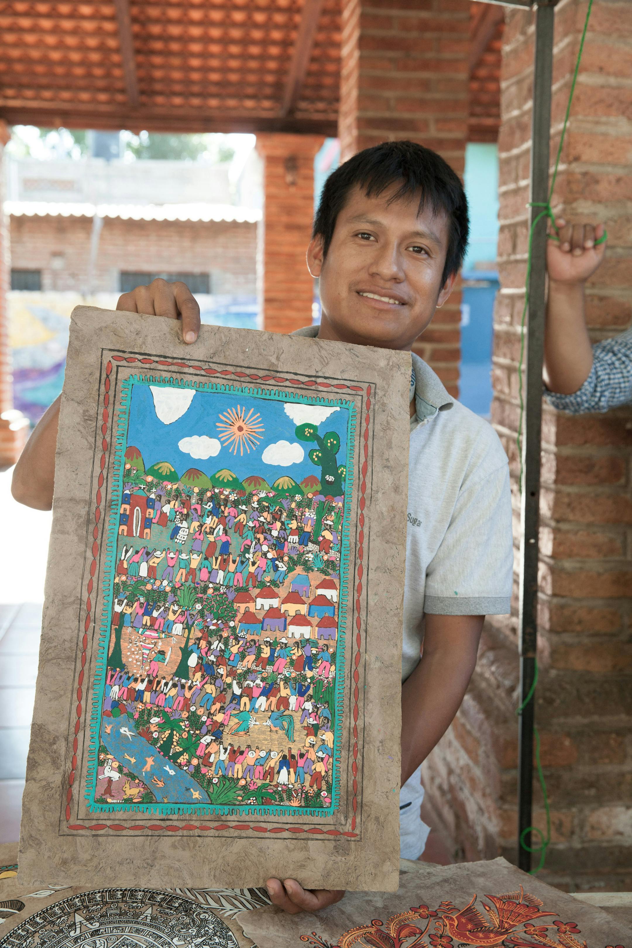 Marco and his dad make a living selling primitive paintings for $10 U.S. on the streets of San Francisco. (Steve Haggerty/TNS)