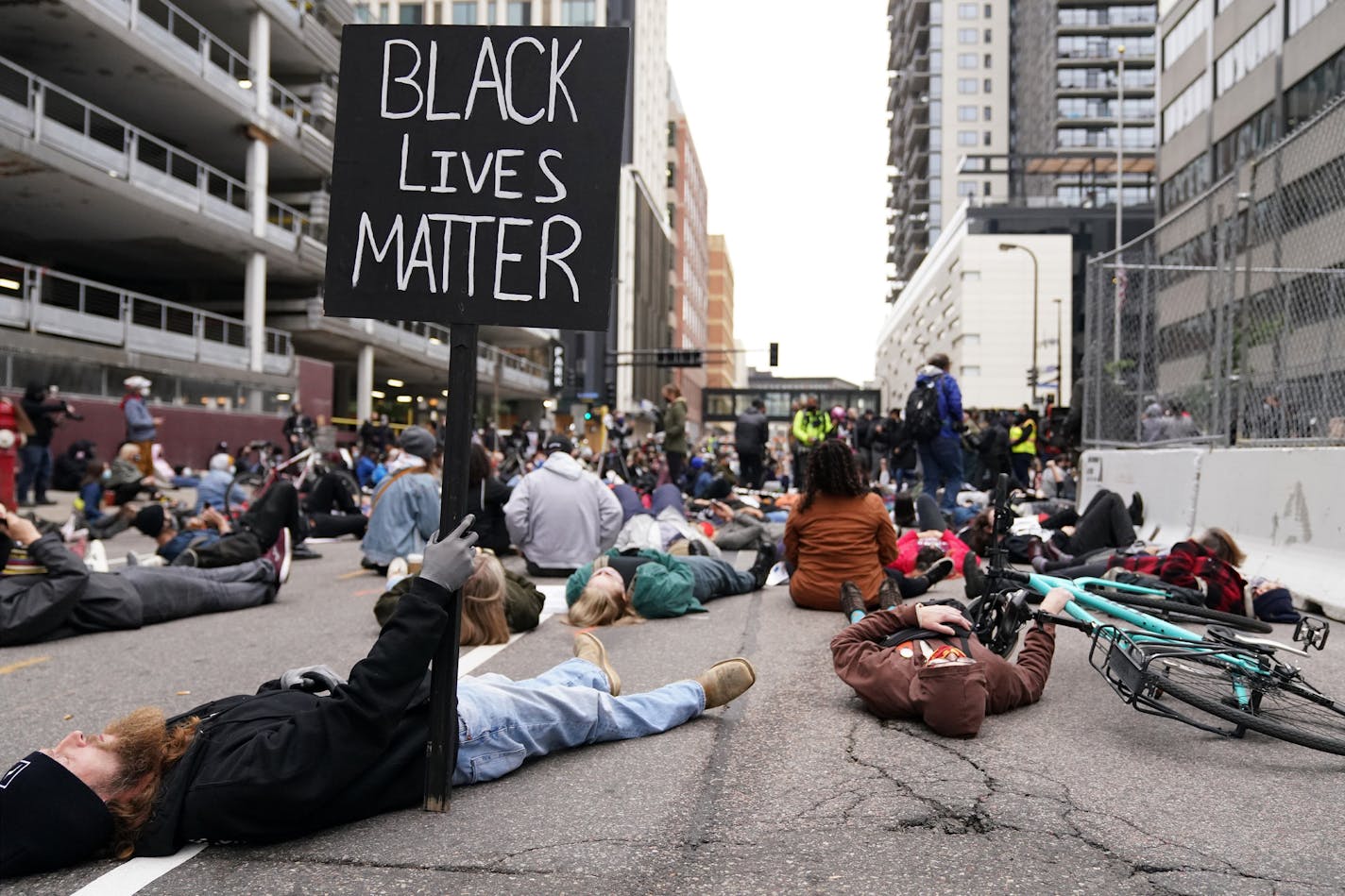 Protesters staged a die in outside the Hennepin County Family Justice Center as family and defendants arrived for a hearing on several pending motions in the cases against four former Minneapolis officers in the killing of George Floyd. ] ANTHONY SOUFFLE • anthony.souffle@startribune.com A judge heard oral arguments on several pending motions in the cases against four former officers in the killing of George Floyd, including motions to dismiss the cases, Friday, Sept. 11, 2020 at the Hennepin Co