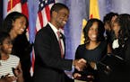 Melvin Carter and his wife Sakeena Carter were joined on stage by their family as Justice Tanya Bransford with the Fourth Judicial District administer