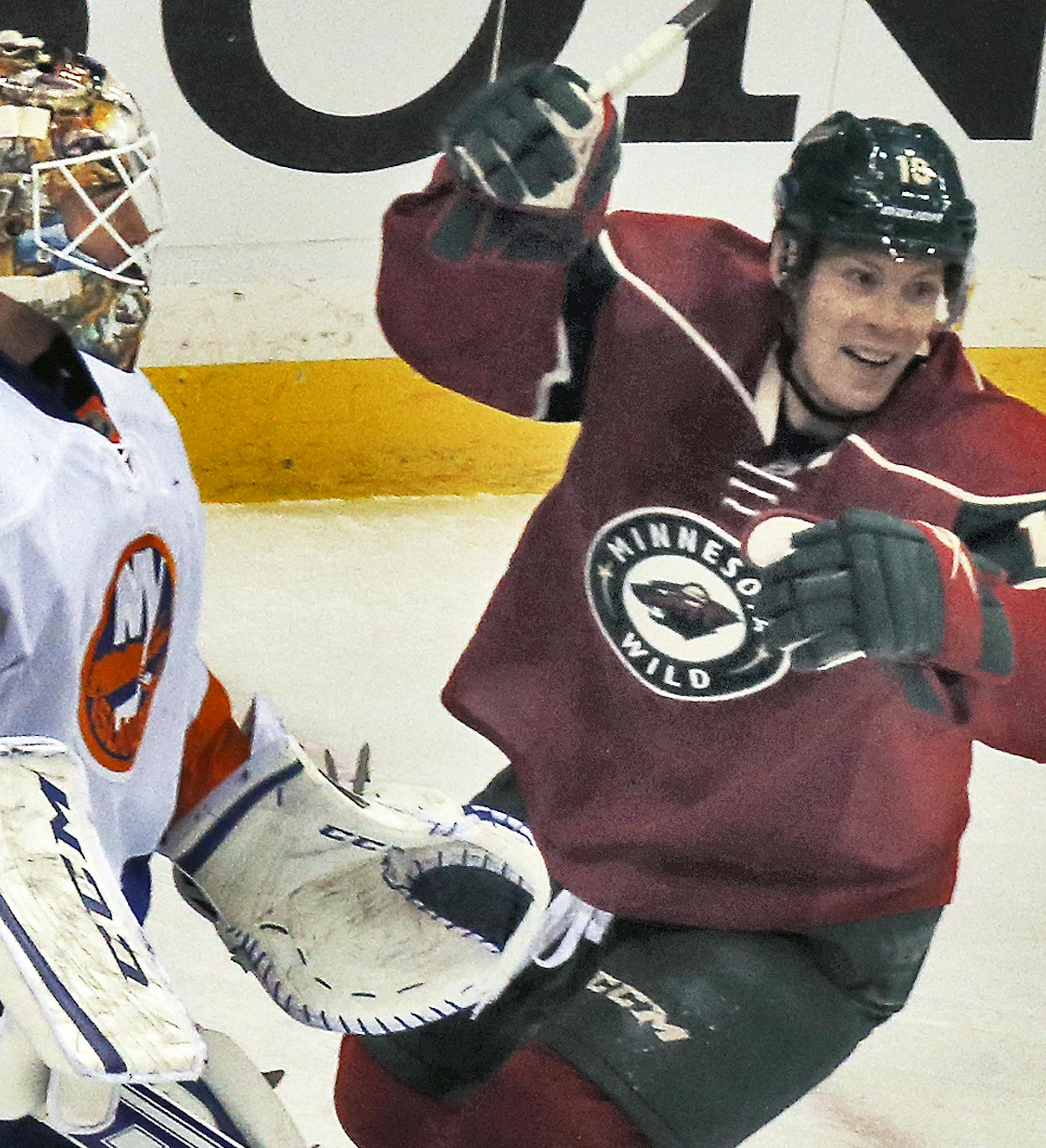 Minnesota Wild vs. New York Islanders. Wild Stephane Veilleux (19) started the celebration after teammate Ryan Suter scored a first period goal beating Islander goalie Kevin Poulin, left. (MARLIN LEVISON/STARTRIBUNE(mlevison@startribune.com)