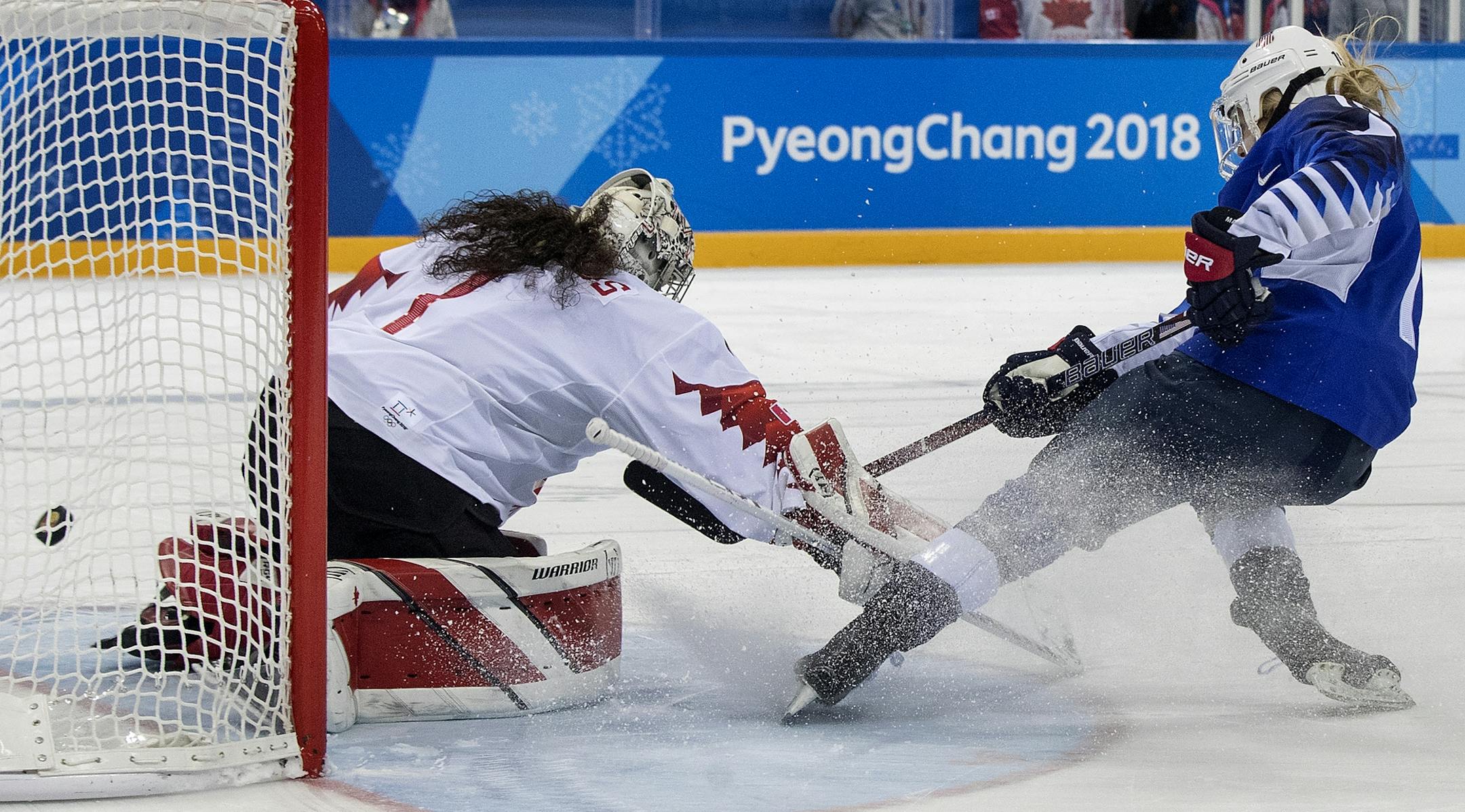 Gigi Marvin (19) shot the puck past Canada goalie Shannon Szabados (1) during the shootout.
