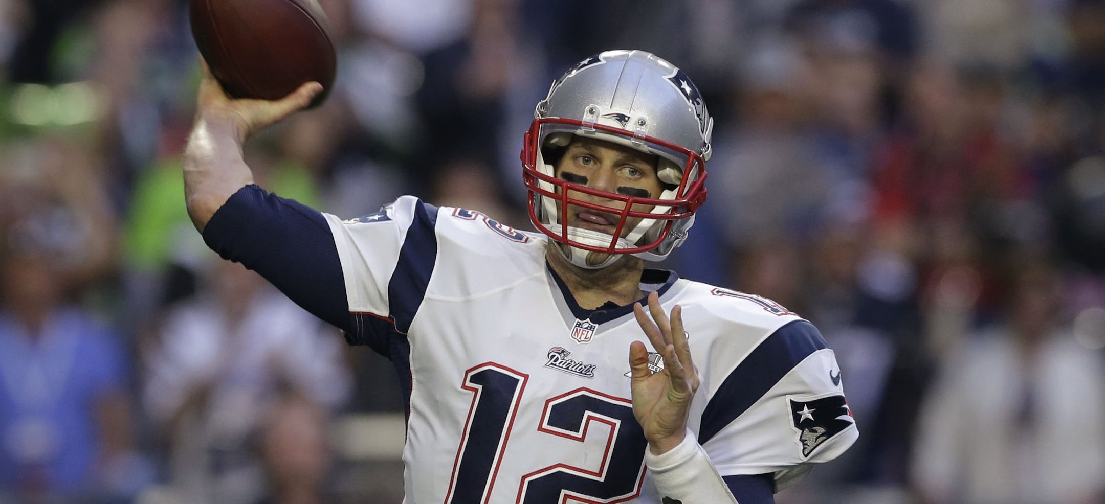 FILE - In this Sunday, Feb. 1, 2015 file photo, New England Patriots quarterback Tom Brady (12) passes against the Seattle Seahawks during the first half of NFL Super Bowl XLIX football game in Glendale, Ariz. Without the games to distract from the issues, football fans were left to ponder the NFL's policies, its commissioner and its overall credibility during an uncomfortable offseason for the league. Tom Brady and the Patriots got a favorable ruling from a New York judge, meaning the quarterba