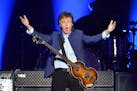 FILE -- Paul McCartney greets the crowd at the start of his "One on One" tour on Wednesday, April 13, 2016, at the Save Mart Center in Fresno, Calif.