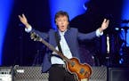 FILE -- Paul McCartney greets the crowd at the start of his "One on One" tour on Wednesday, April 13, 2016, at the Save Mart Center in Fresno, Calif.