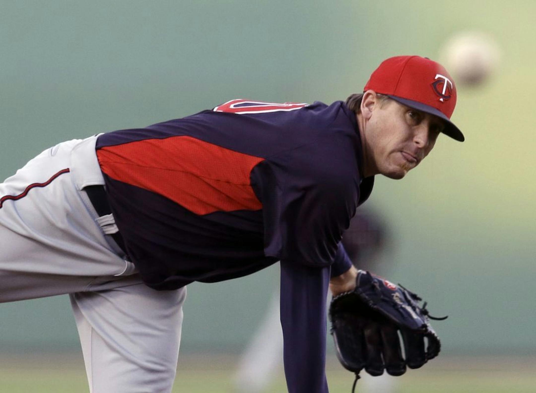 Twins starting pitcher Kevin Correia delivers to the Red Sox in the first inning of a spring training game