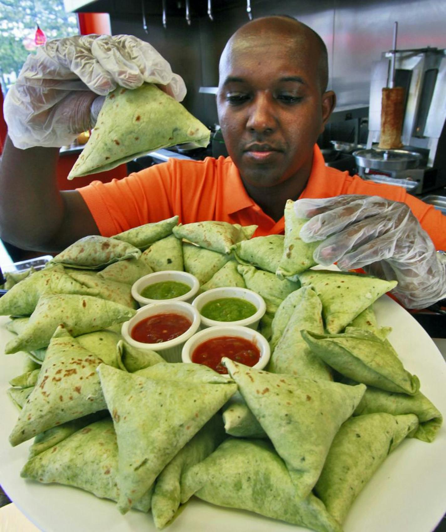 Afro Deli & Coffee Restaurant in Minneapolis is one of five contestants in the first-ever Sambusa Cook-Off event Saturday in Minneapolis. The contest is designed to raise awareness and help Somali youth in Somalia through the American Refuge Committee. Abdirahman Kahin, the owner of the restaurant displayed some of the 350 sambusas his restaurant is cooking for the competition. Friday July 8, 2011.