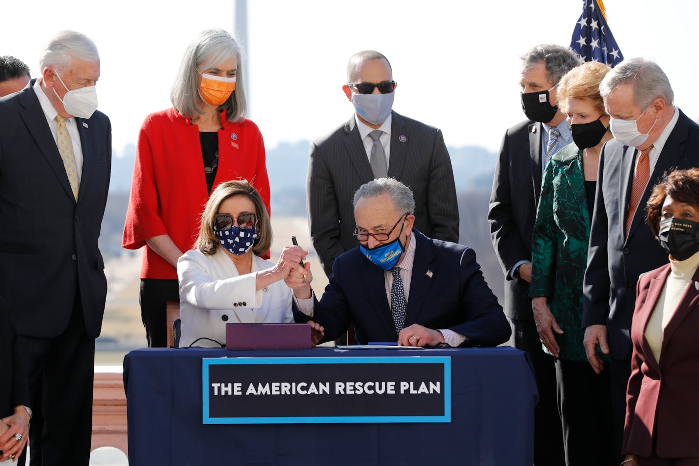 U.S. House Speaker Nancy Pelosi (D-California) and Senate Majority Leader Chuck Schumer (D-New York) sign the Bill Enrollment for the Biden American Rescue Plan on Capitol Hill in Washington, D.C. on Wednesday, March 10, 2021. (Yuri Gripas/Abaca Press/TNS) ORG XMIT: 10736440W