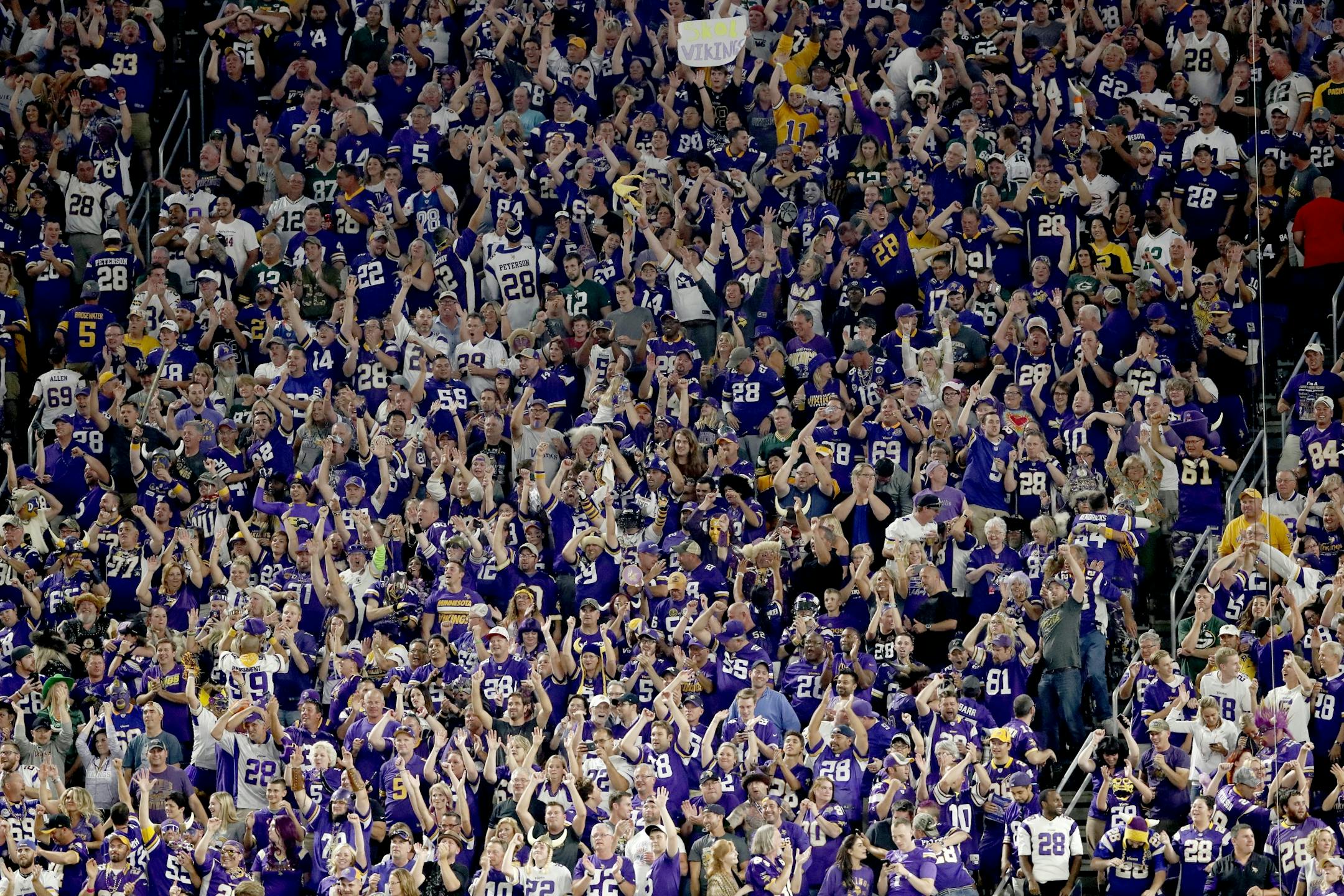 Fans reacted after Trae Waynes (26) intercepted a pass off of Green Bay Packers quarterback Aaron Rodgers in the fourth quarter.