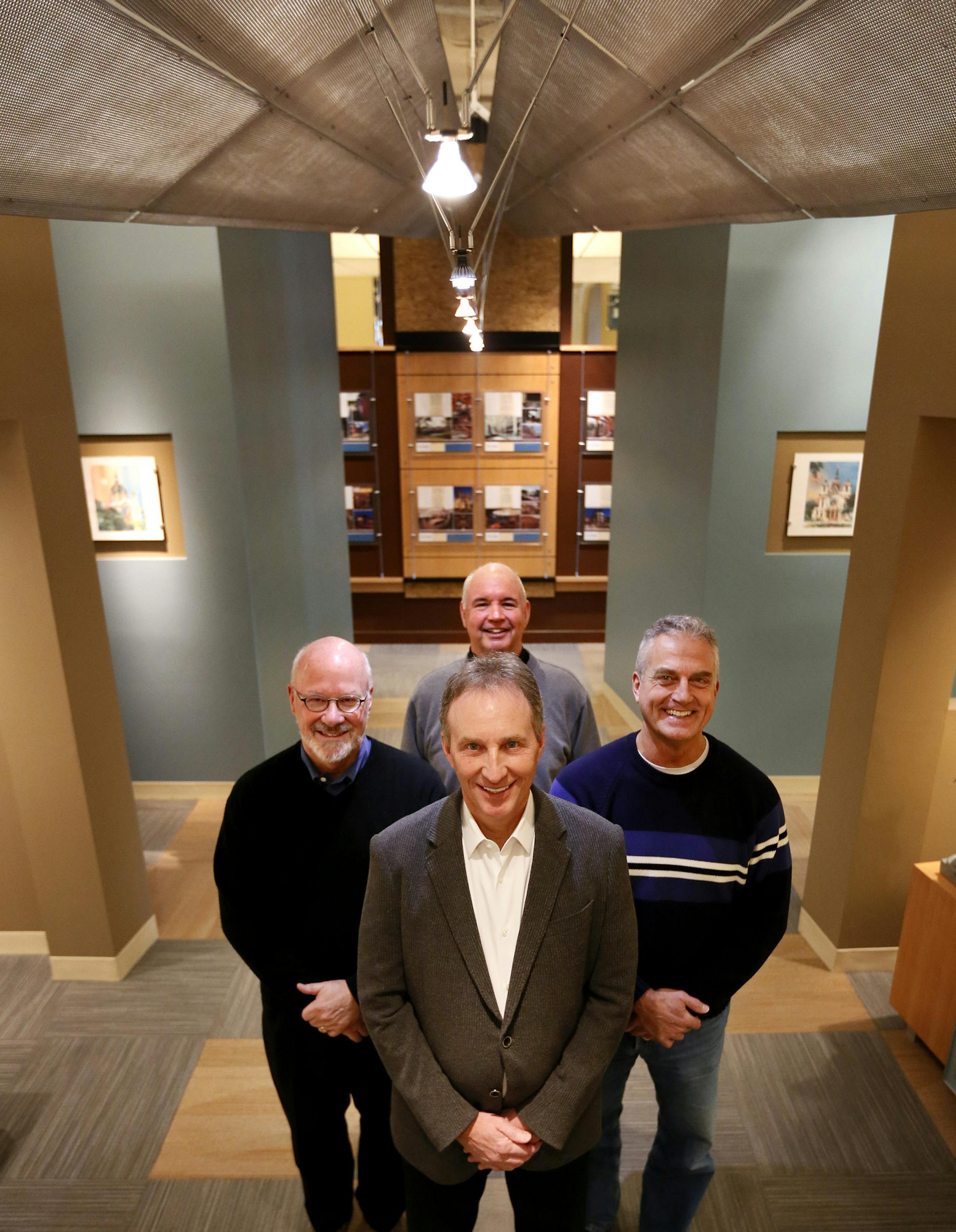 Miller Dunwiddie Architects are celebrating the firm's 50th anniversary. It's one of the few independent firms in the state to have stuck around that long, and is responsible for the Humphrey Terminal at the MSP Airport, the restorations of the St. Paul Cathedral, Saint Mary's Basilica and Minnesota State Capitol, and Folwell Hall at the U of M. Here, four of the firm principals Craig Lau (front), Chuck Liddy (left), John Mecum (right) and Mark Miller (back), at their office in the Warehouse Dis
