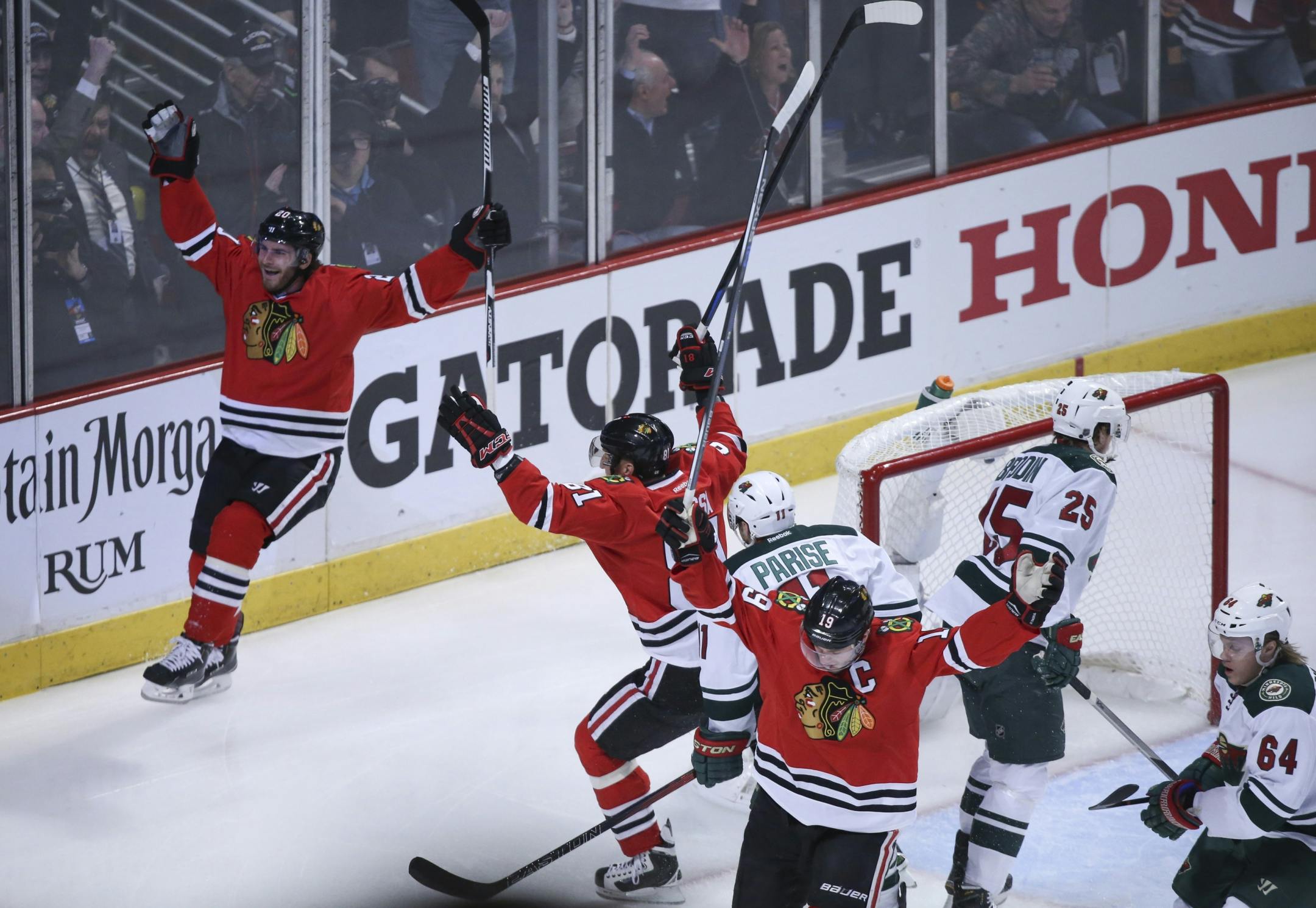 Blackhawks left wing Brandon Saad, left, celebrated after he gave Chicago a goal early in the first period Friday night.