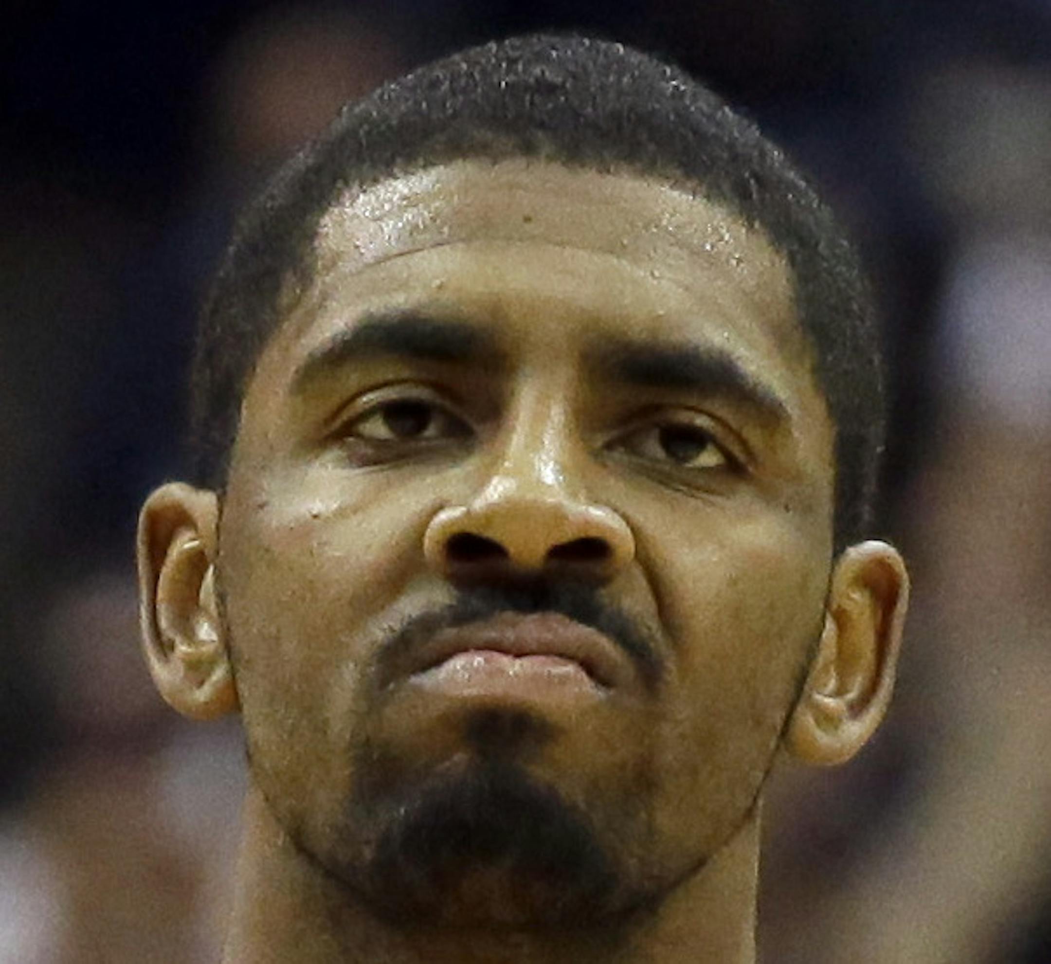 Cleveland Cavaliers guard Kyrie Irving (2) reacts after hitting the final 3-point basket of the game against Dallas Mavericks guard Wesley Matthews (23) during overtime in an NBA basketball game Tuesday, Jan. 12, 2016, in Dallas. The Cleveland Cavaliers won 110-107. (AP Photo/LM Otero) ORG XMIT: MIN2016012218253224