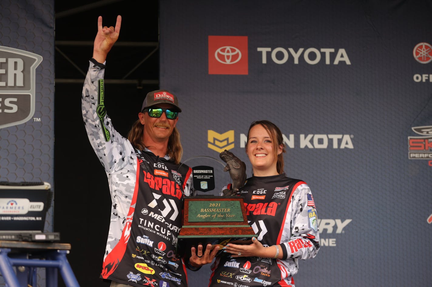 Seth Feider, left, celebrated his Angler of the Year championship in the Bassmaster Elite Series tour Friday in New York.