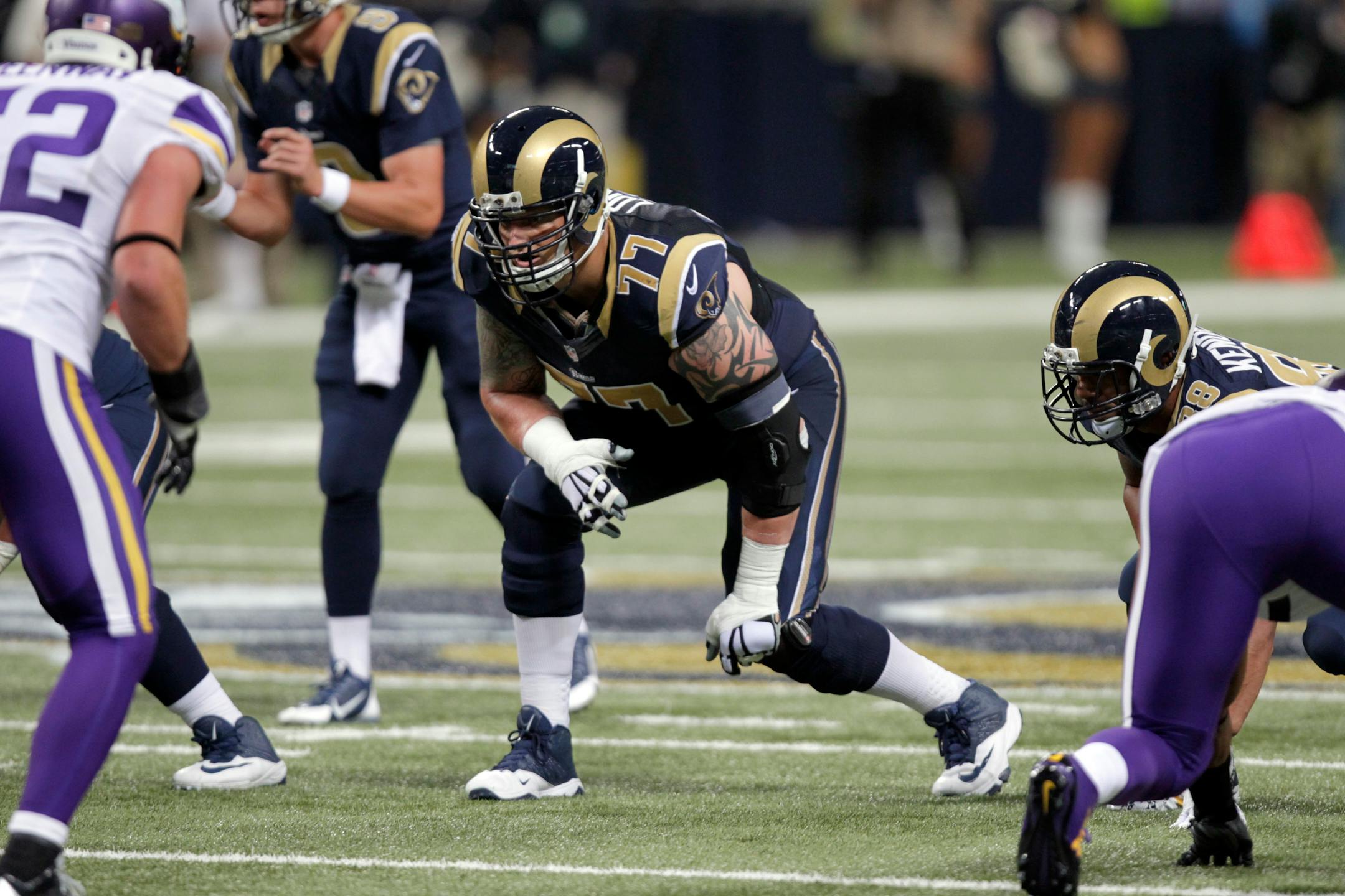 St. Louis Rams offensive tackle Jake Long takes his position against the Vikings in 2014. On Tuesday, Minnesota signed Long.