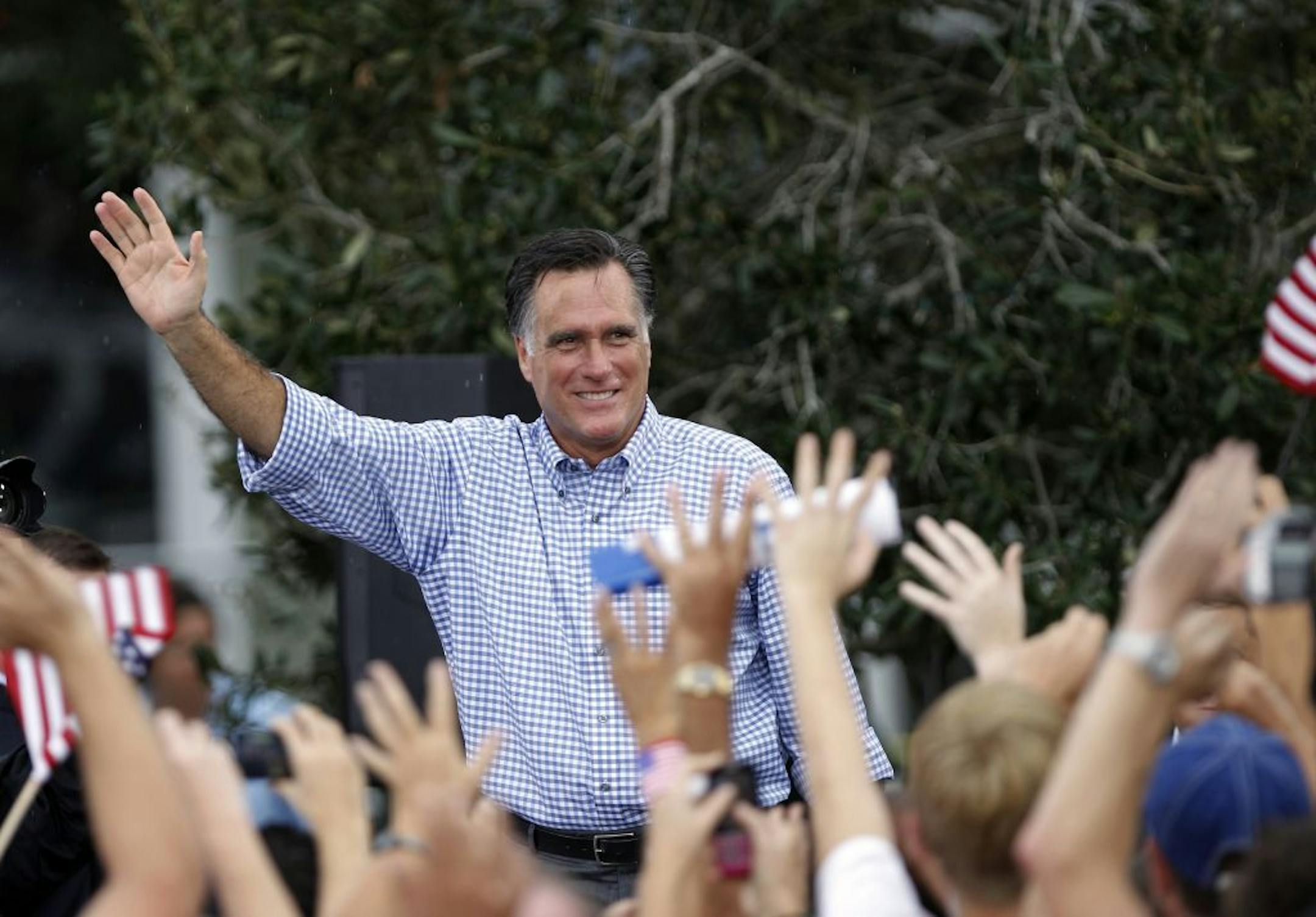 Republican presidential candidate and former Massachusetts Gov. Mitt Romney waves following a campaign rally, Sunday, Oct. 7, 2012 in Port St. Lucie, Fla.