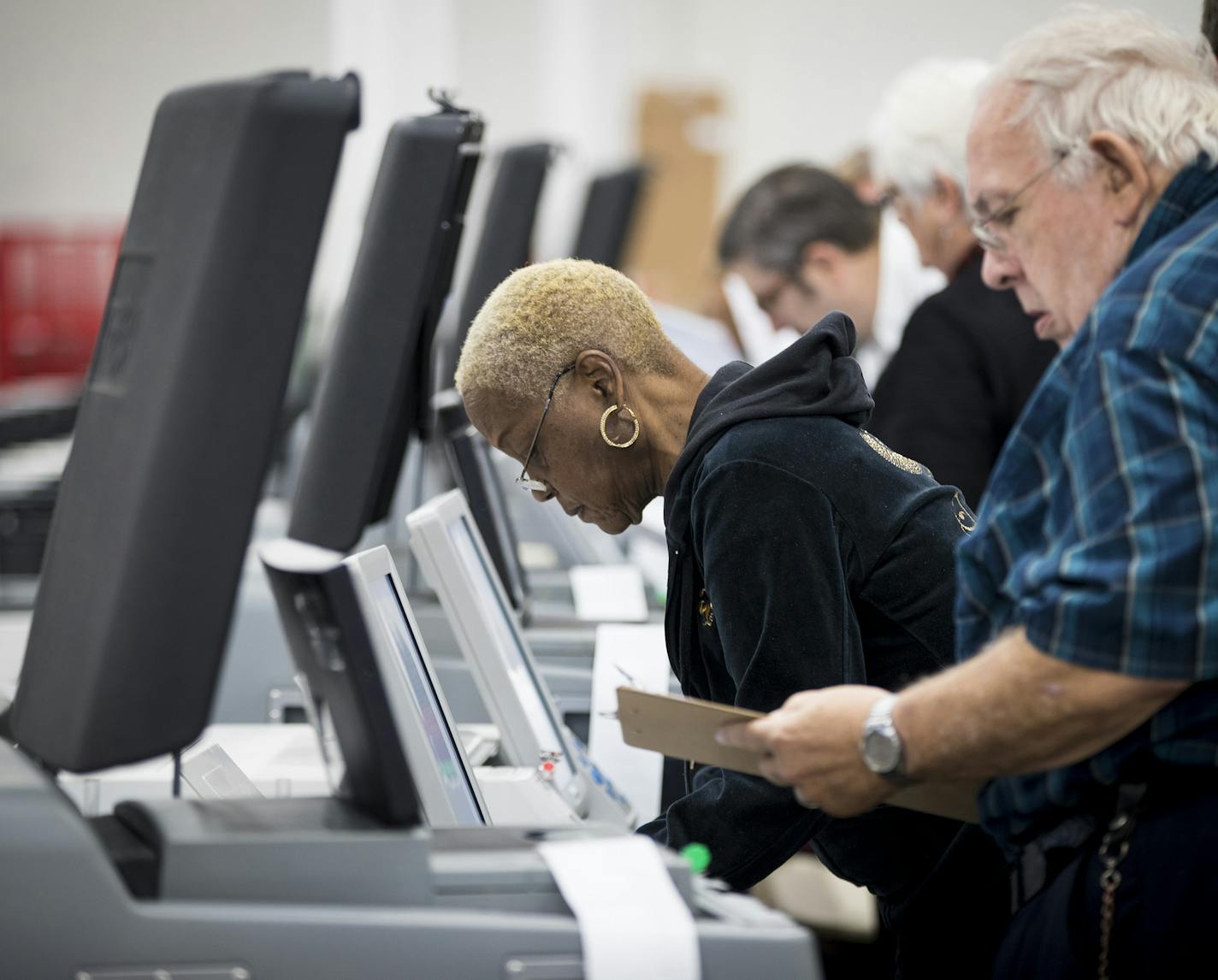 Election judges from ward 1, precinct 10, Joan Curtis and Merlin Davis, conduct a public accuracy test with a ballot tabulator on Tuesday, Nov. 1, 2016 at the Minneapolis Elections & Voters Services equipment warehouse in Minneapolis, Minn. (Renee Jones Schneider/Minneapolis Star Tribune/TNS)