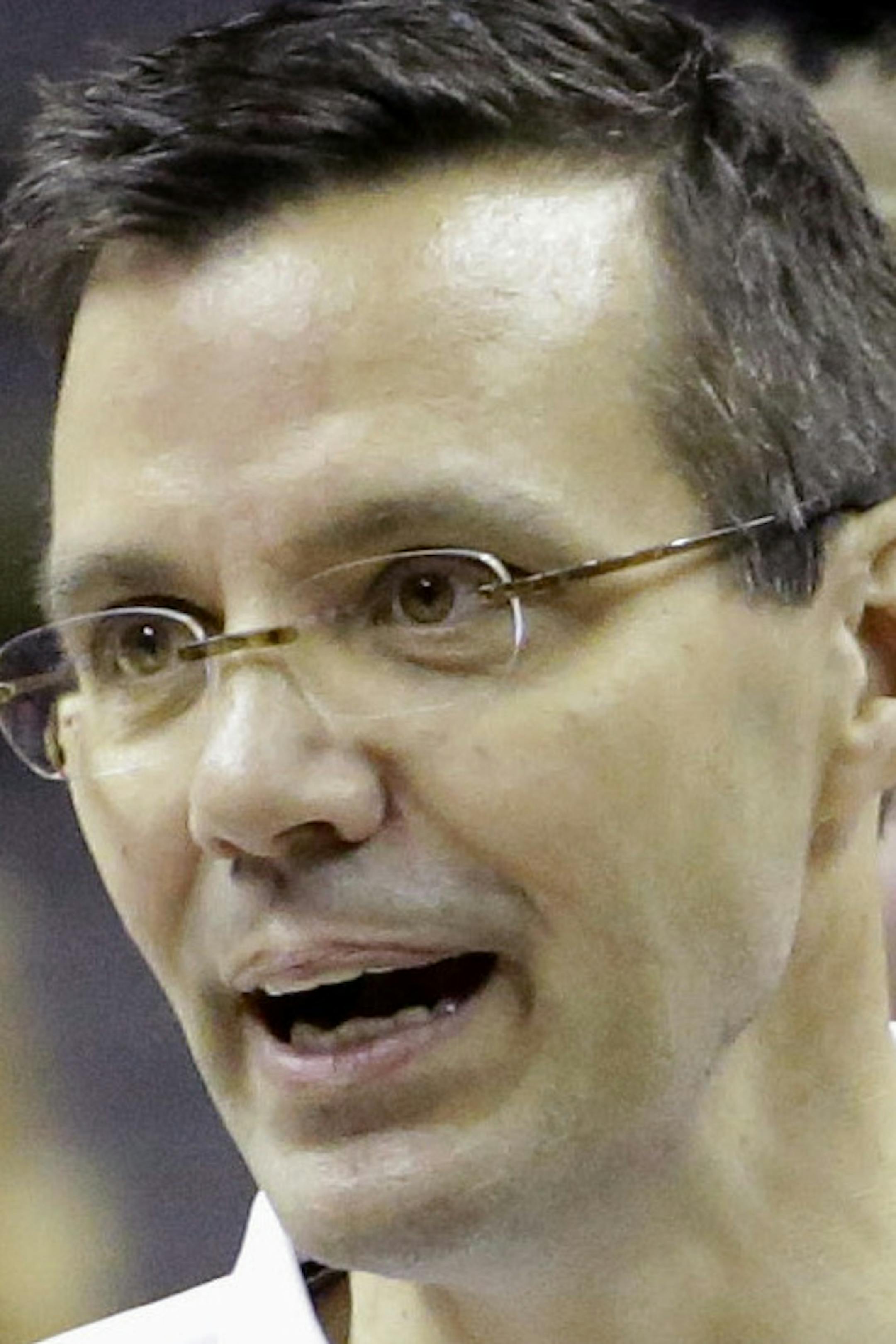 Nebraska coach Tim Miles, center, talks to his team during practice for the NCAA college basketball tournament in San Antonio, Thursday, March 20, 2014. Nebraska plays against Baylor in a second-round game on Friday. (AP Photo/David J. Phillip)