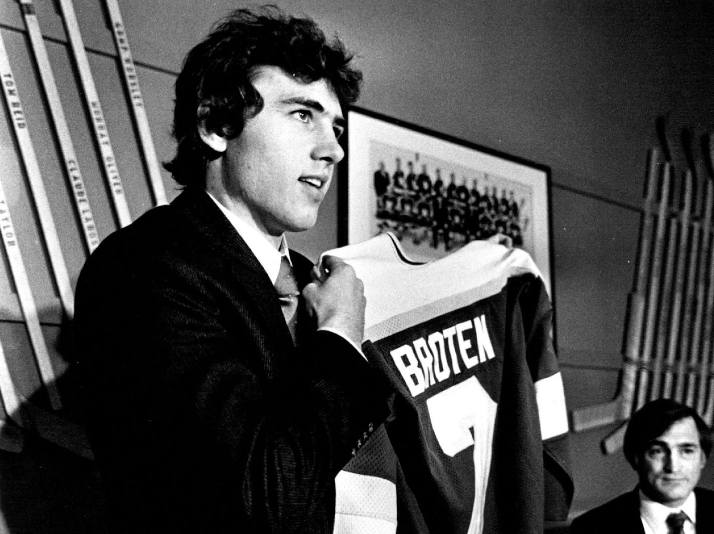 In a memorable week in March 1981, Neal Broten held up his new North Stars jersey on March 30 with General Manager Lou Nanne looking on. He signed two days after the Gophers' loss in the NCAA final, and made his NHL debut the next night, on March 31.