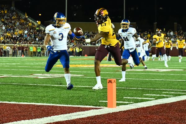 Gophers wide receiver Rashod Bateman caught the ball for a touchdown late in the second quarter with South Dakota State safety Joshua Manchigiah in pu