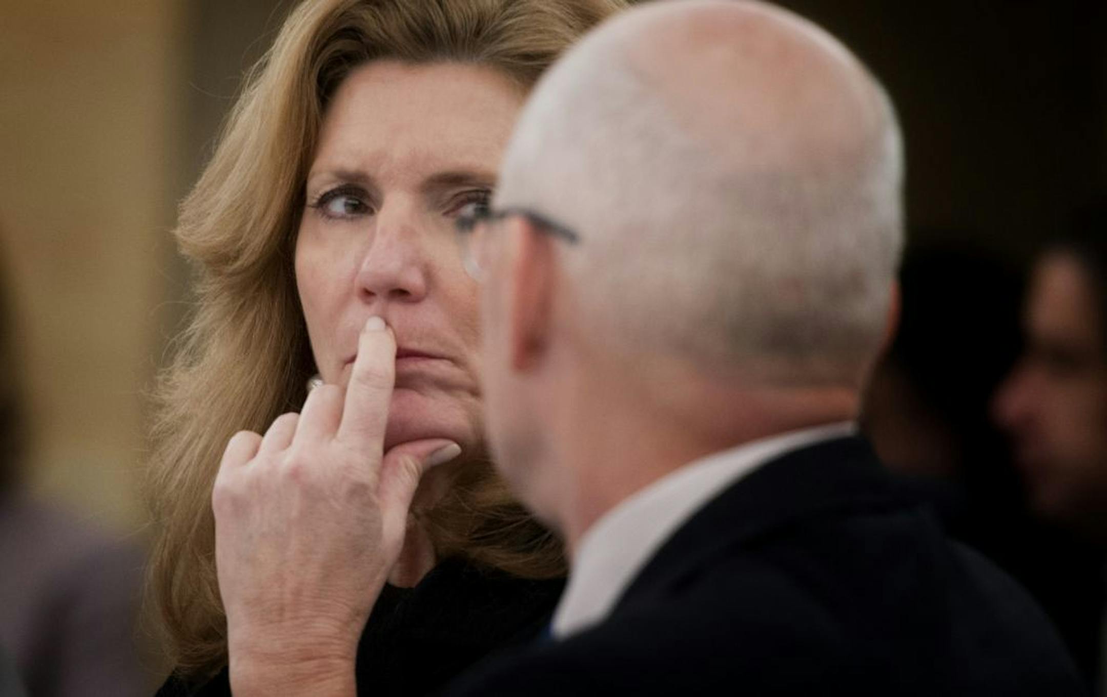 Stadium bill sponsor Sen. Julie Rosen conferred with Revenue Commissioner Myron Frans after the bill faced tough questions from the Senate finance committee on Wednesday.