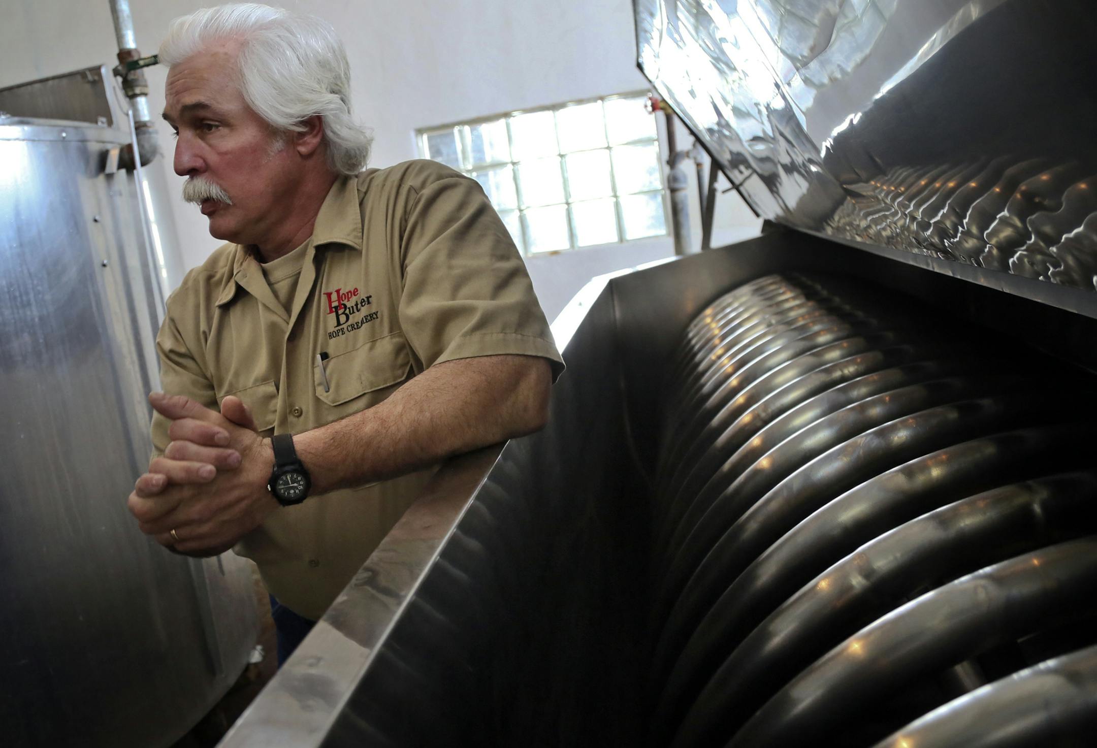 Victor Mrotz, the owner of Hope Creamery, stood near two pasteurizing machines at his small, renowned butter-making business.