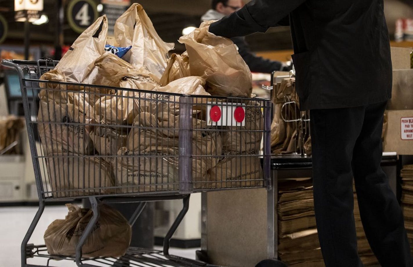 A shopper loaded up a cart full of plastic bags at a Duluth grocery store on Monday Nov. 25. The City Council passed an ordinance that will require retailers to charge a nickel for plastic bags starting in April.