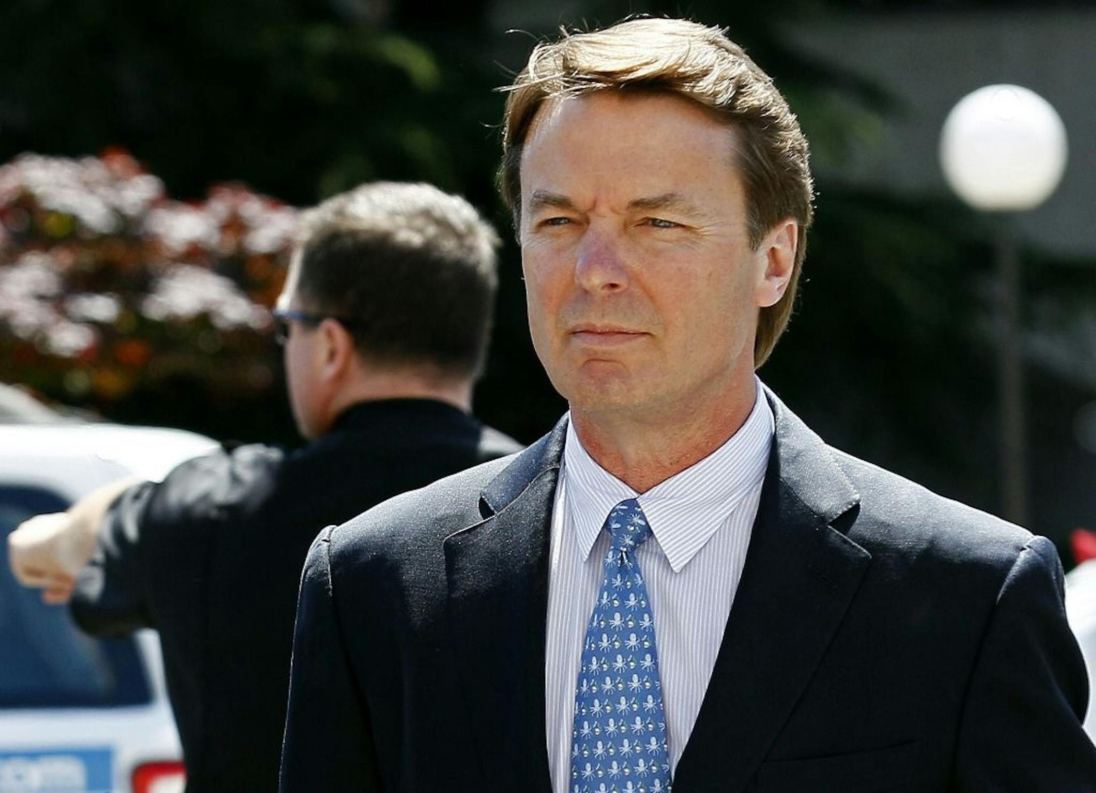Former presidential candidate and U.S. Sen. John Edwards arrives outside federal court following a lunch break in Greensboro, N.C., April 12, 2012, during jury selection in his criminal trial on alleged campaign finance violations.