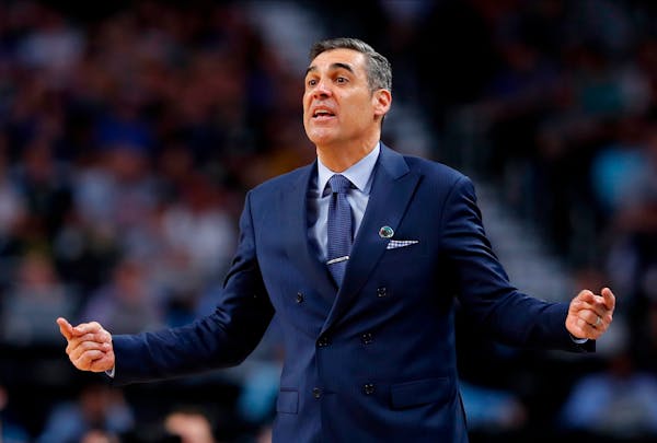 Villanova head coach Jay Wright directs his team during the second half against Kansas in the semifinals of the Final Four NCAA college basketball tou