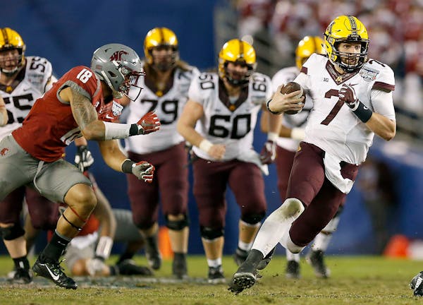 Minnesota's quarterback Mitch Leidner ran for a first down during the second quarter as they took on Washington State at Qualcomm Stadium for the San 