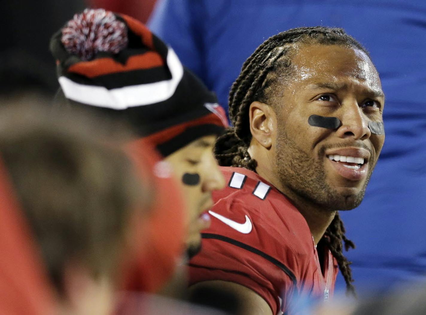 Arizona Cardinals' Larry Fitzgerald looks at the scoreboard during the second half the NFL football NFC Championship game against the Carolina Panthers, Sunday, Jan. 24, 2016, in Charlotte, N.C.