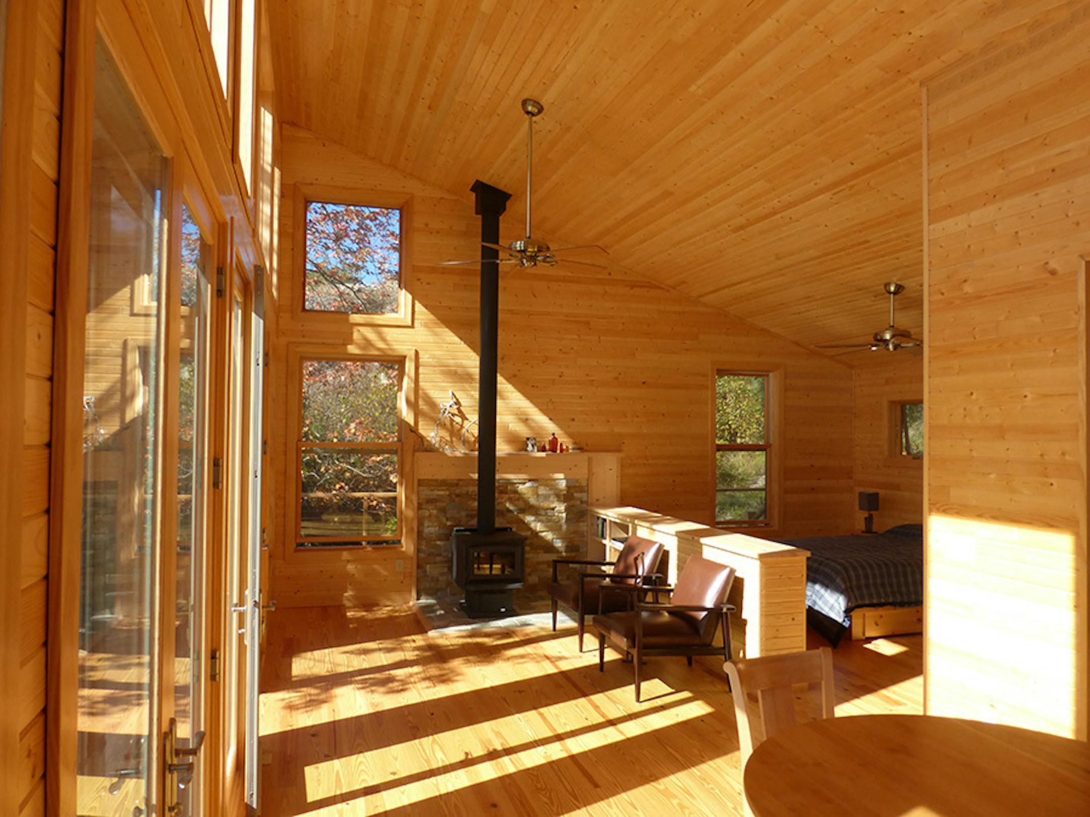 Ripple Island Cabin. Rustic one room cabin hat captures sunlight and views in northern Minnesota, by Ken Stone.