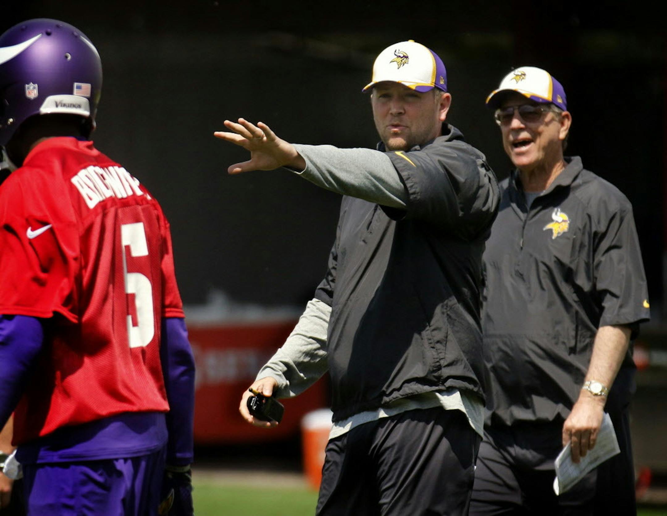 Minnesota Vikings quarterback coach Scott Turner with father Norv Turner, the offensive coordinator, worked with quarterback Teddy Bridgewater during practice on February 14, 2014, at Winter Park in Eden Prairie.