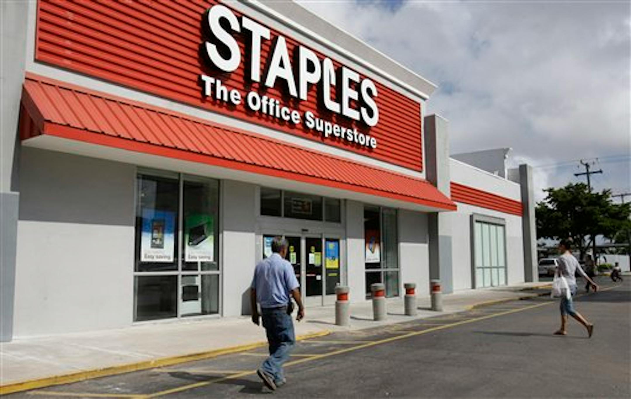 A Staples office supply store is photographed Tuesday, Nov. 15, 2011, in Miami. Staples Inc. said Tuesday that its profit climbed 13 percent in the third quarter, helped in part by improved sales of office and break room supplies to businesses as well as promotional products. (AP Photo/ Lynne Sladky)