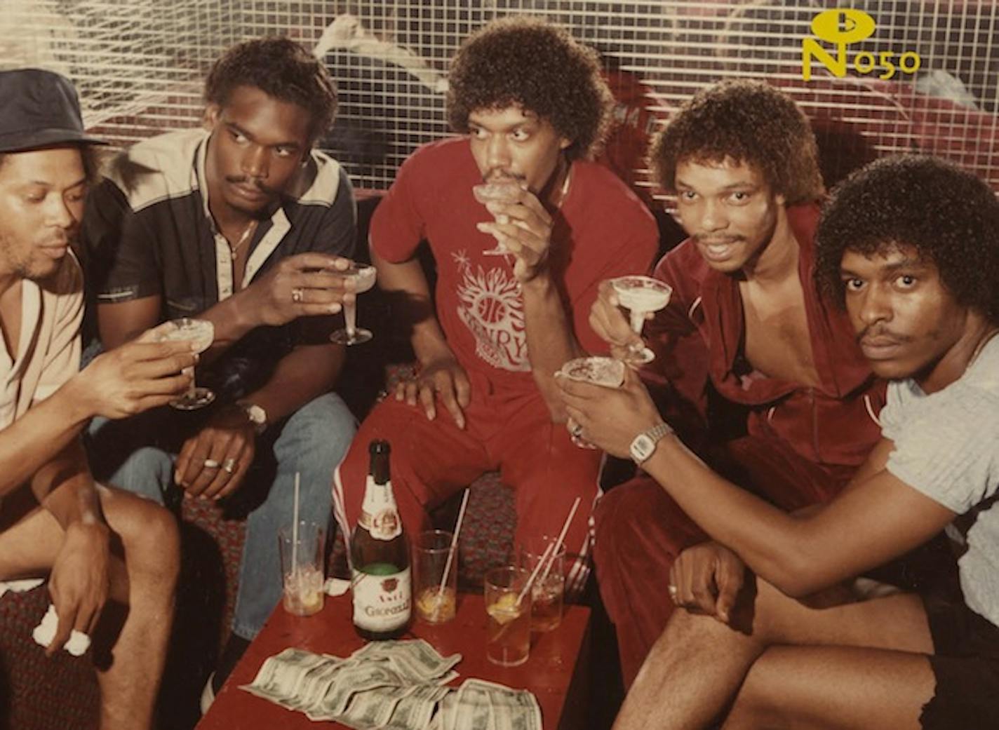 The cover of "Purple Snow" is a vintage photo of patrons at the Taste Show Lounge in downtown Minneapolis. (Photograph by Charles Chamblis, courtesy of Minnesota Historical Society)