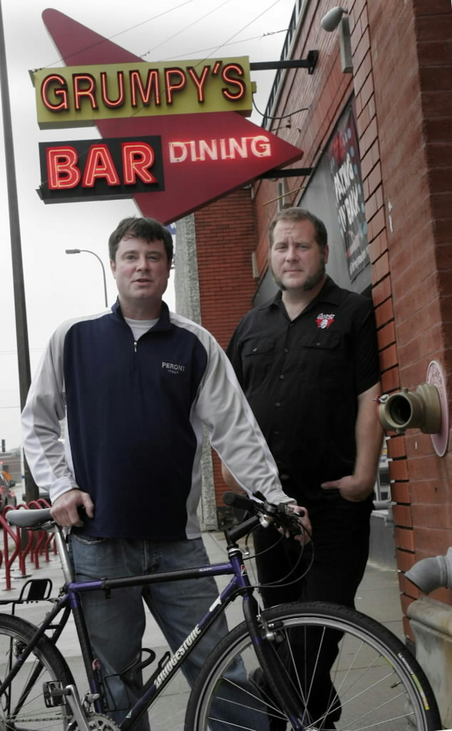 Grumpy's co-owners Pat Dwyer, left, and Tom Hazelmyer outside their downtown bar in 2007.